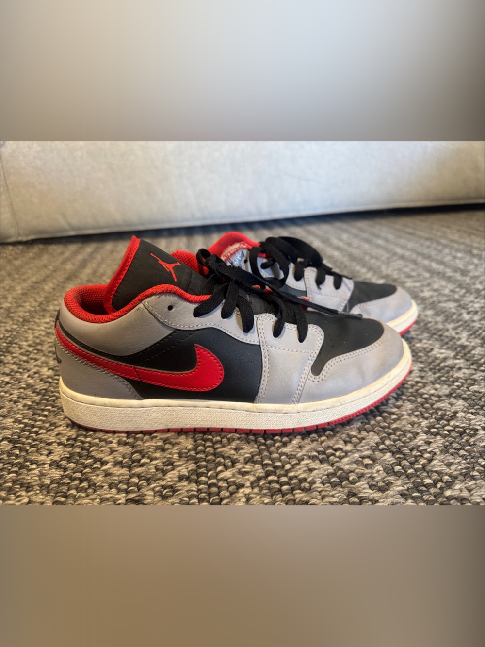 Nike Air Jordan 1 Low in the "Black/Cement Gray/Fire Red big kids size 6